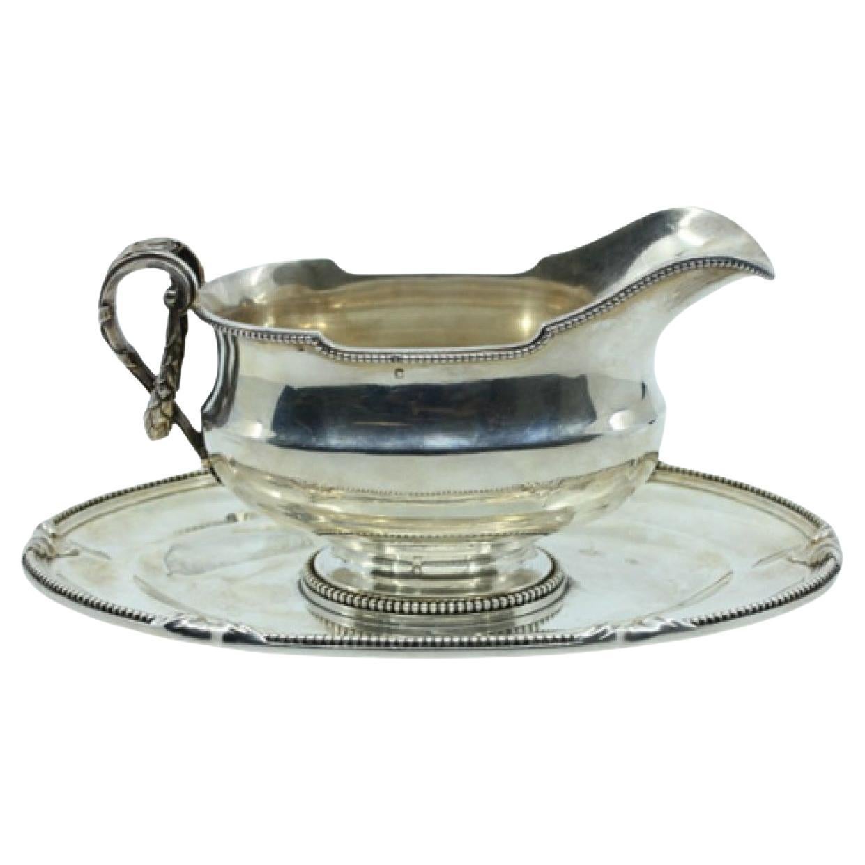 Silver gravy boat and platter with pearly surround and appliqués on the plate For Sale
