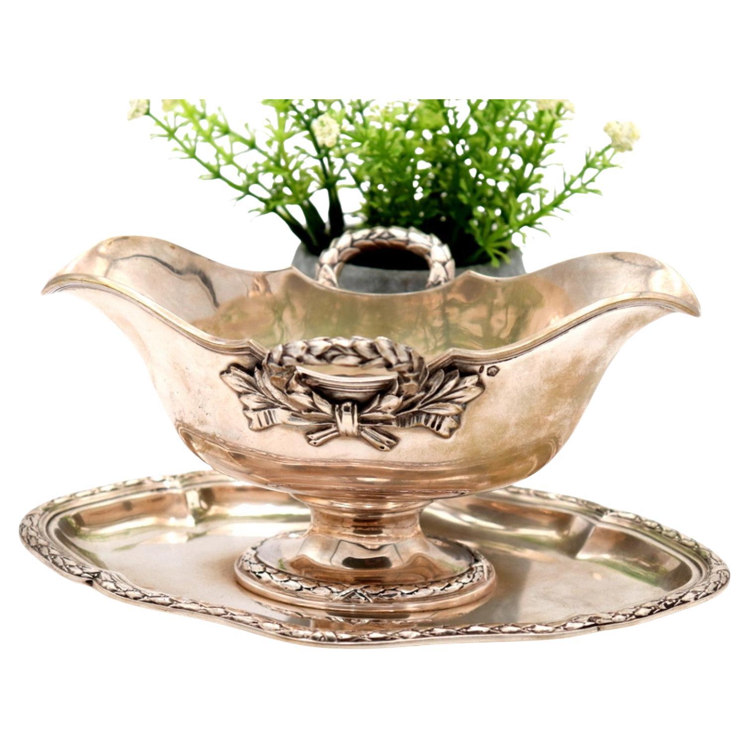 Silver gravy boat with plate, beaded handles, and ambidextrous system