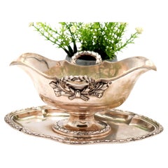 Silver gravy boat with plate, beaded handles, and ambidextrous system