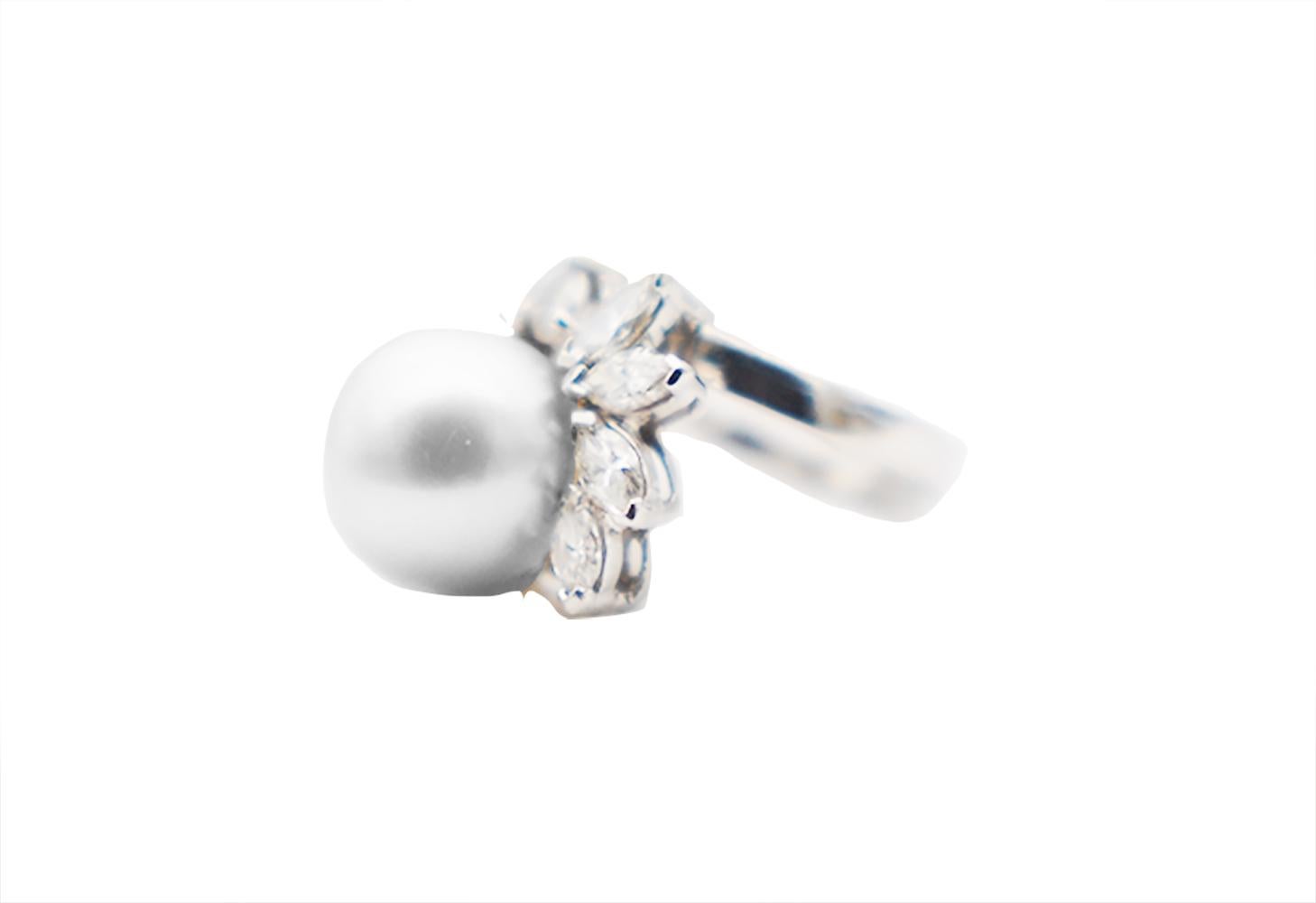 Silver Gray, 12 mm Tahitian Pearl, Wrap Diamond Ring. Beautiful, sparkling 12-diamond ring features center pearl surrounded by 8- marquise and 1- round diamond. The band has a wrap shank consisting of 3- straight baguette diamonds. The quality of