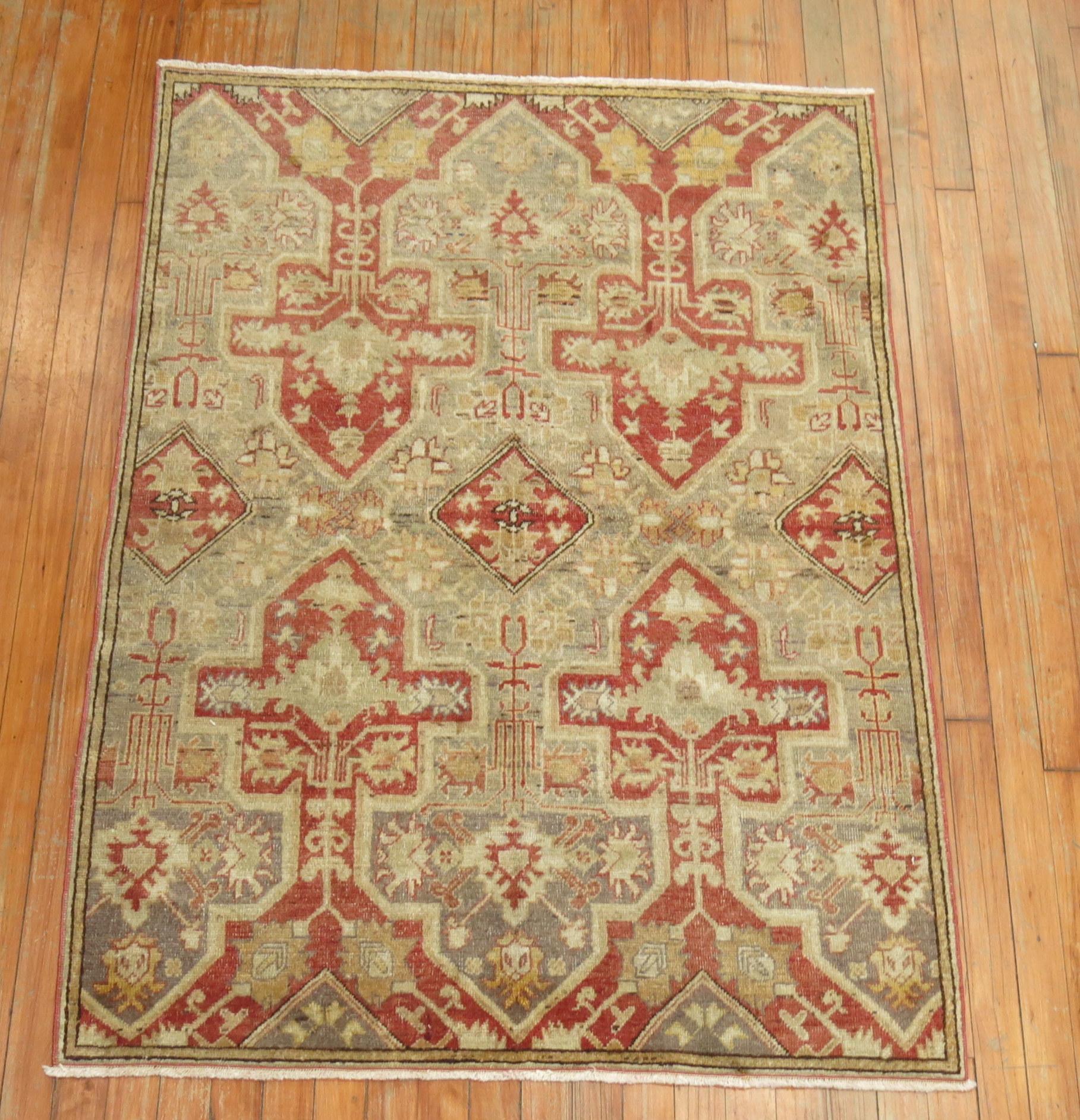 An early 20th century Turkish Sivas rug featuring a silver/gray color background.