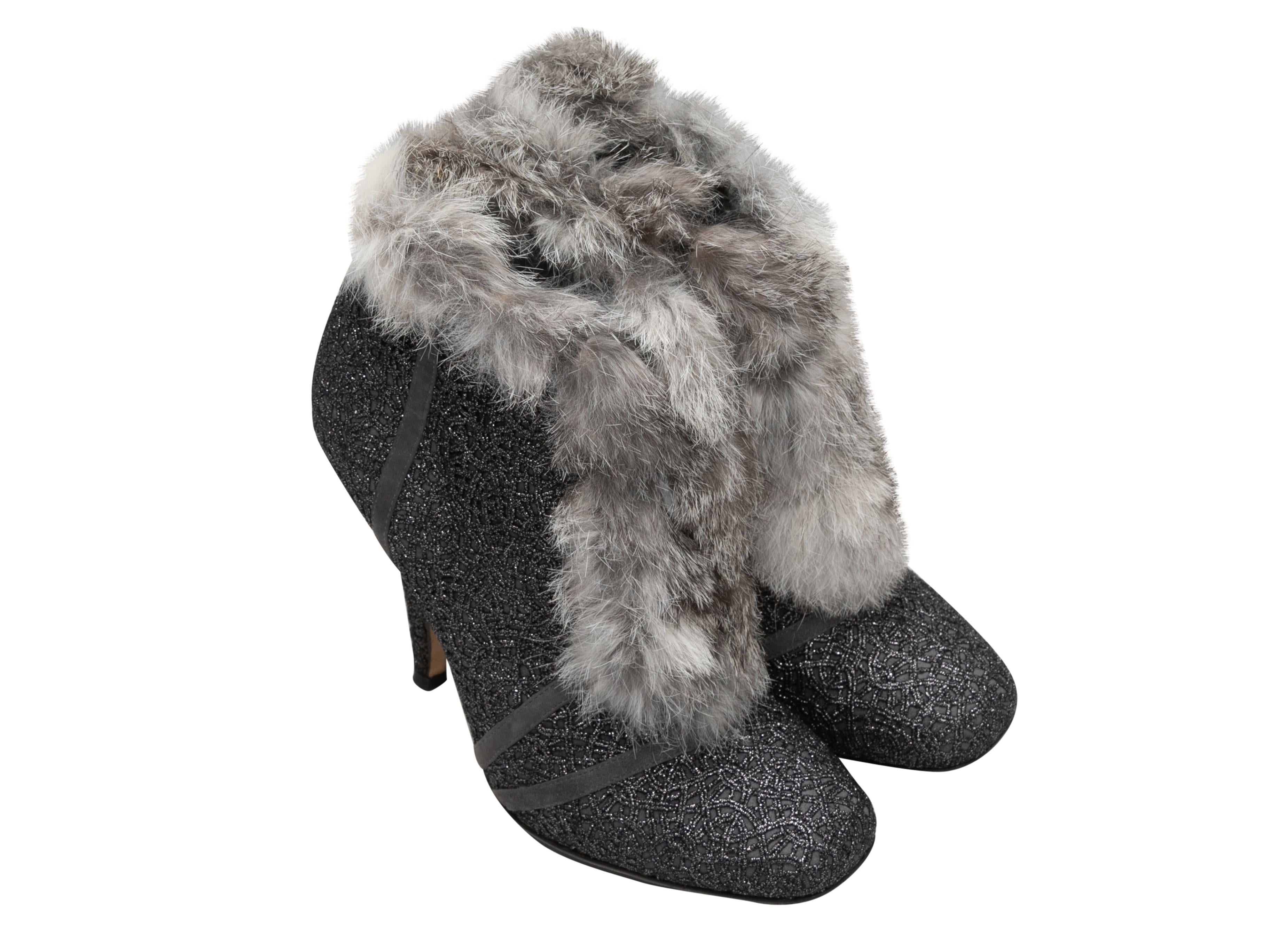 Silver and grey rabbit fur-trimmed heeled booties by Christian Dior. Zip closures at counters. 4