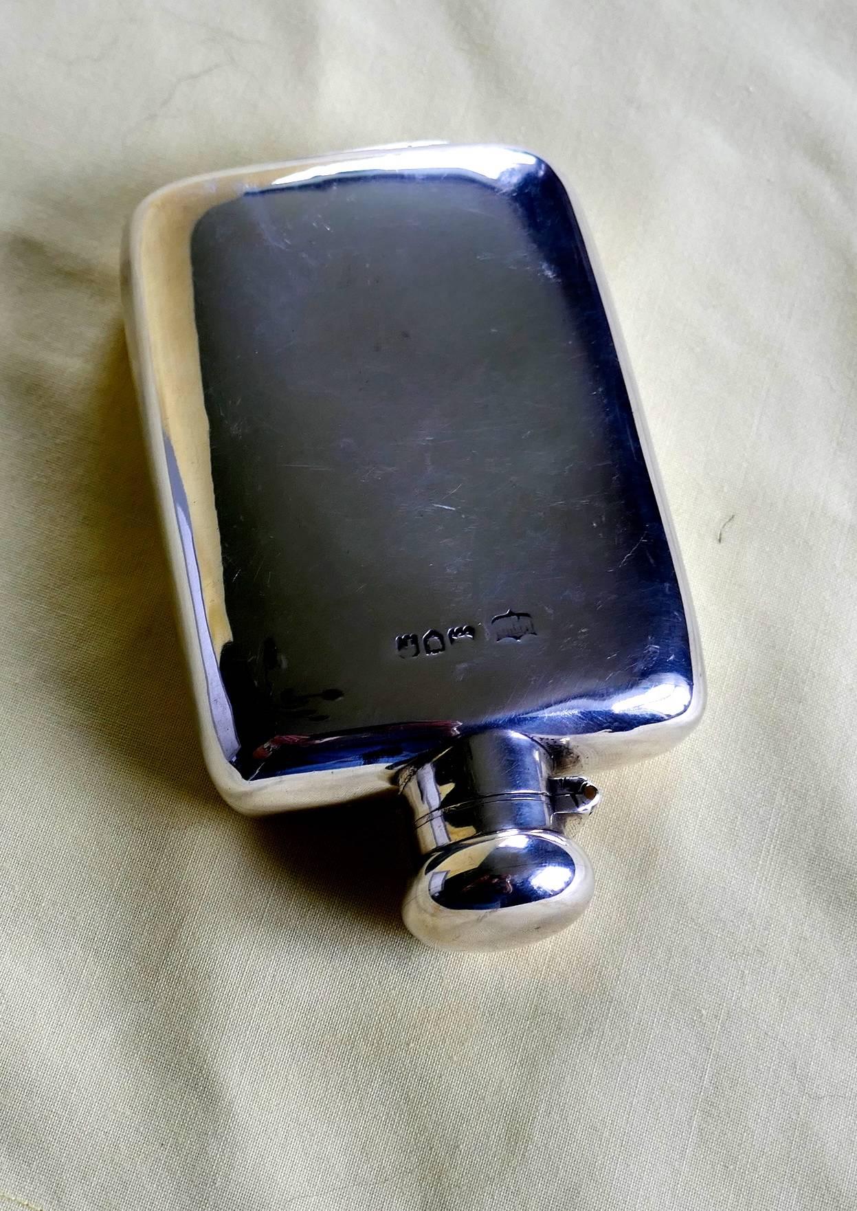 Silver hallmarked hip or pocket flask, 1906

A lovely piece the flask has a rounded shape with no sharp corners, making it ideal to keep in either a breast or hip pocket, the lid is hinged with a screw grip.

The flask is a very nice piece so