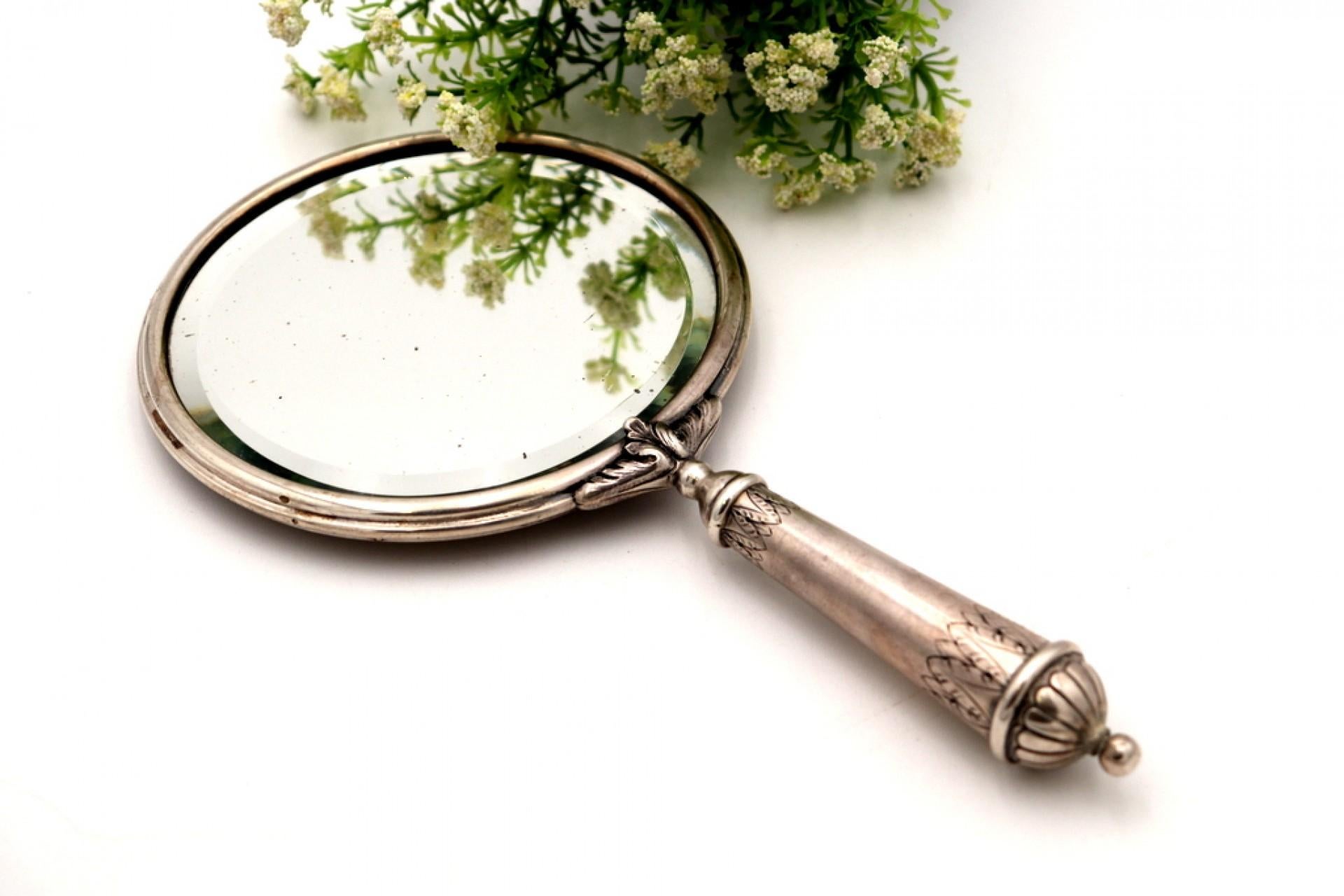 19th Century Silver hand mirror with reliefs and rose applications on the back For Sale