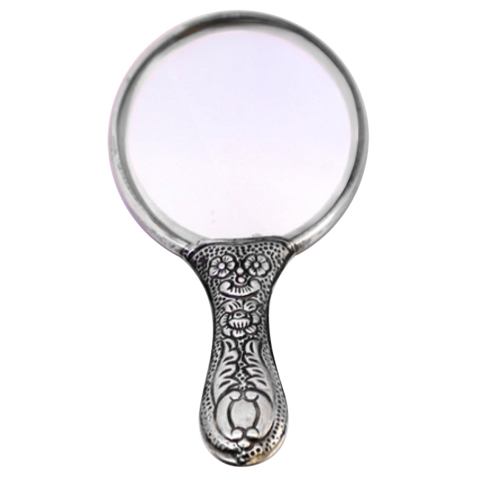 Silver hand mirror with revealed floral motifs