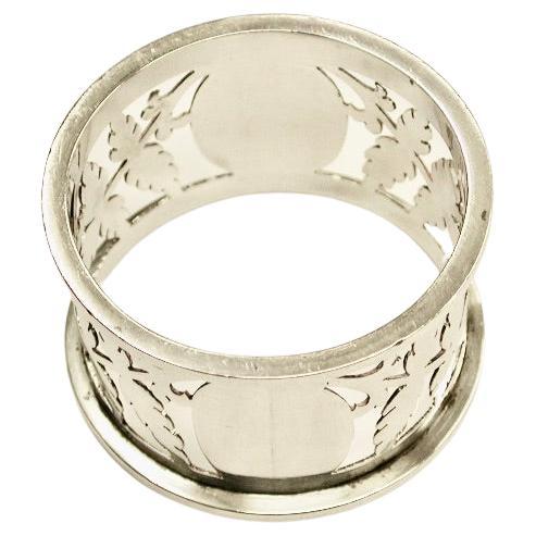 Silver hand pierced napkin ring,William Hutton & Sons Ltd,Sheffield Assay,1902
Heavy quality with hand cut fret saw piercing.
1.23 troy ounces in weight.