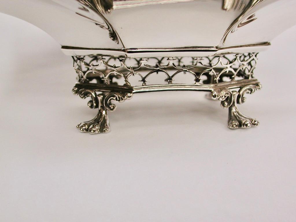 Silver hand pierced sweet basket, George Fox, 1901, London
Retailed by Elkington & Company Ltd at their shop in 22, Regent Street.
The piercing has all been done by hand with a small fret saw.
The feet and all scroll decorations are cast.
14.3