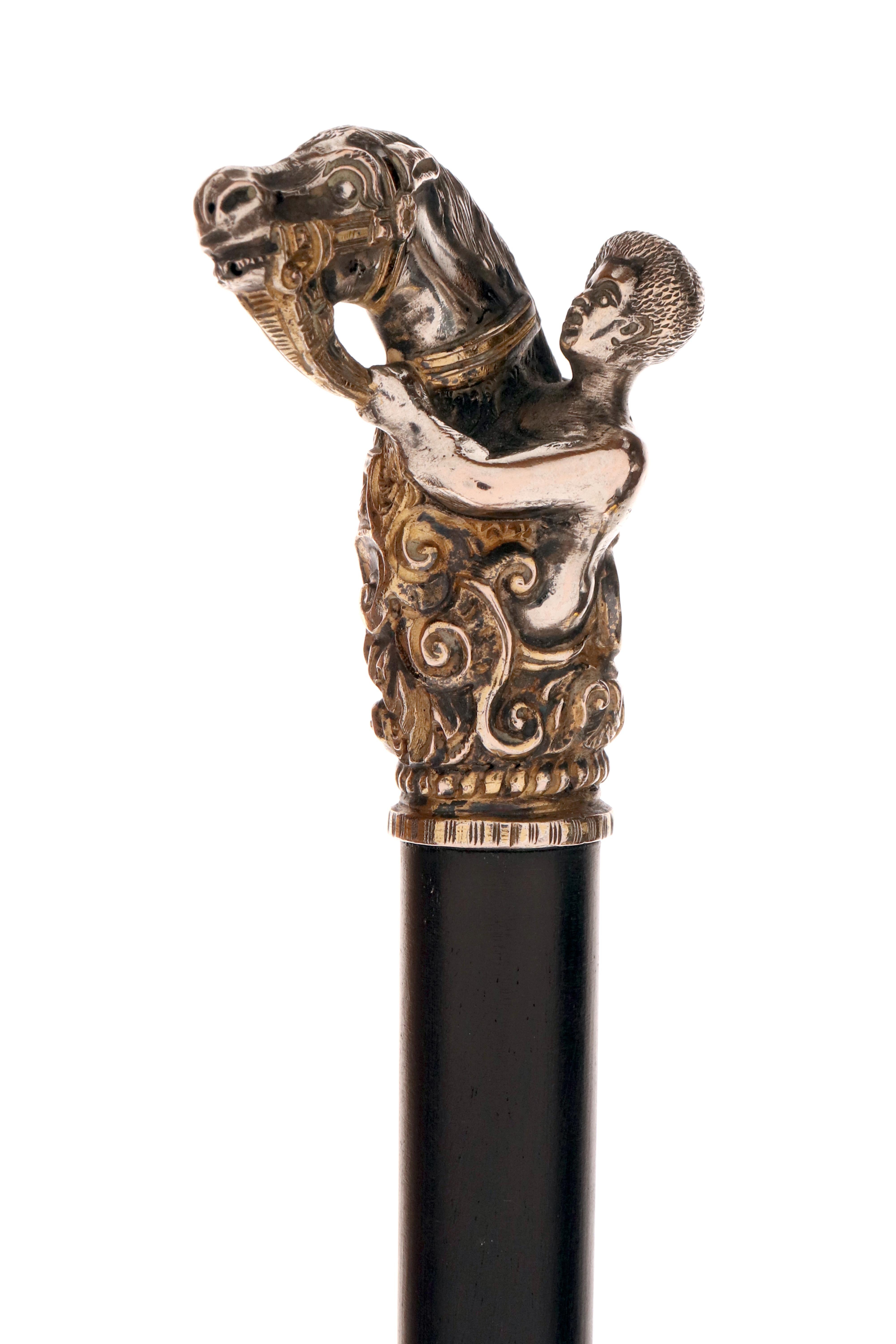 English Silver handle walking stick, depicting a horse head and a jockey, England 1900. For Sale