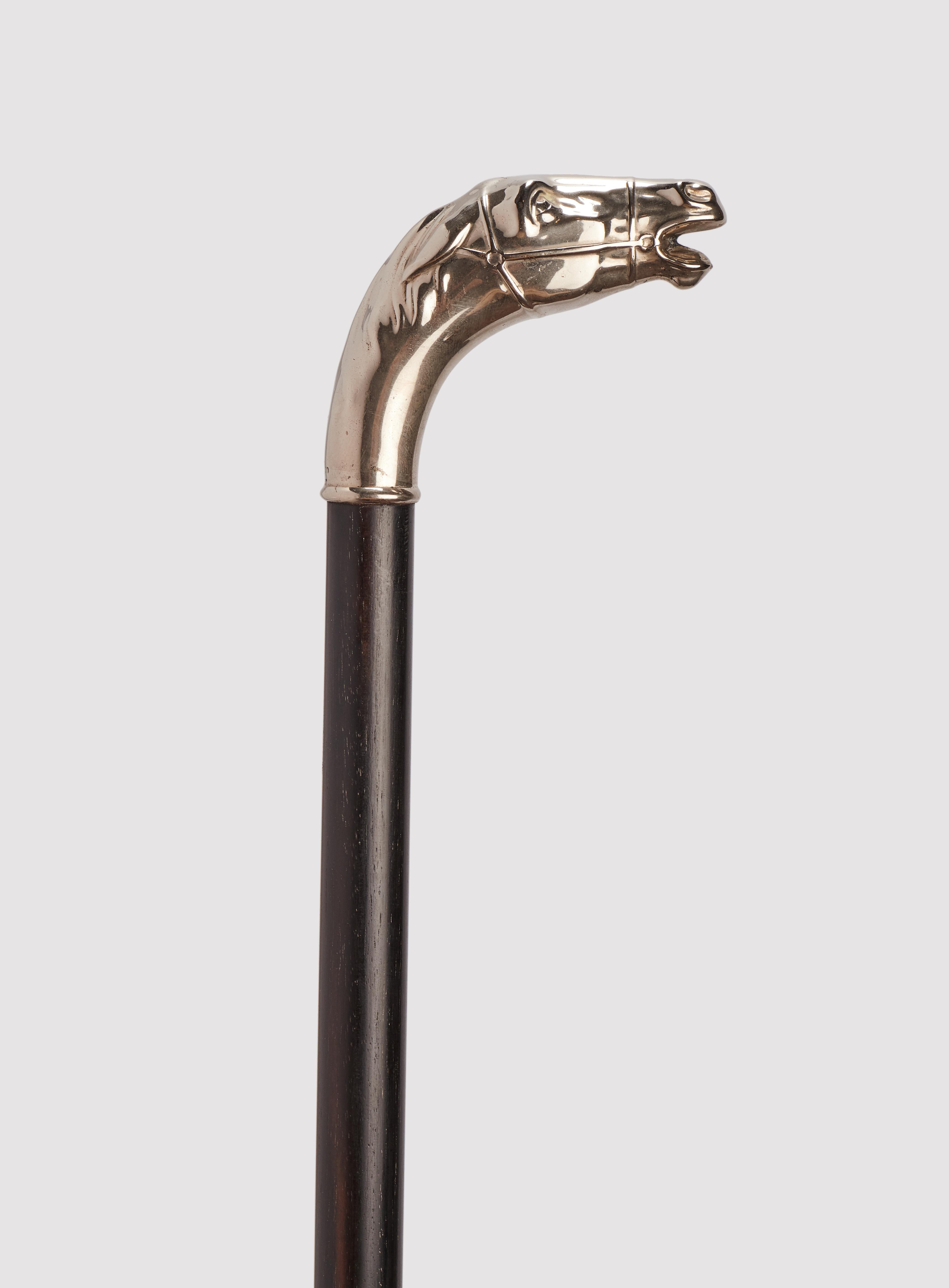 Walking stick: silver handle, depicting the head of a horse. Ebony wood shaft. Metal ferrule, brass and iron. Germany circa 1900.