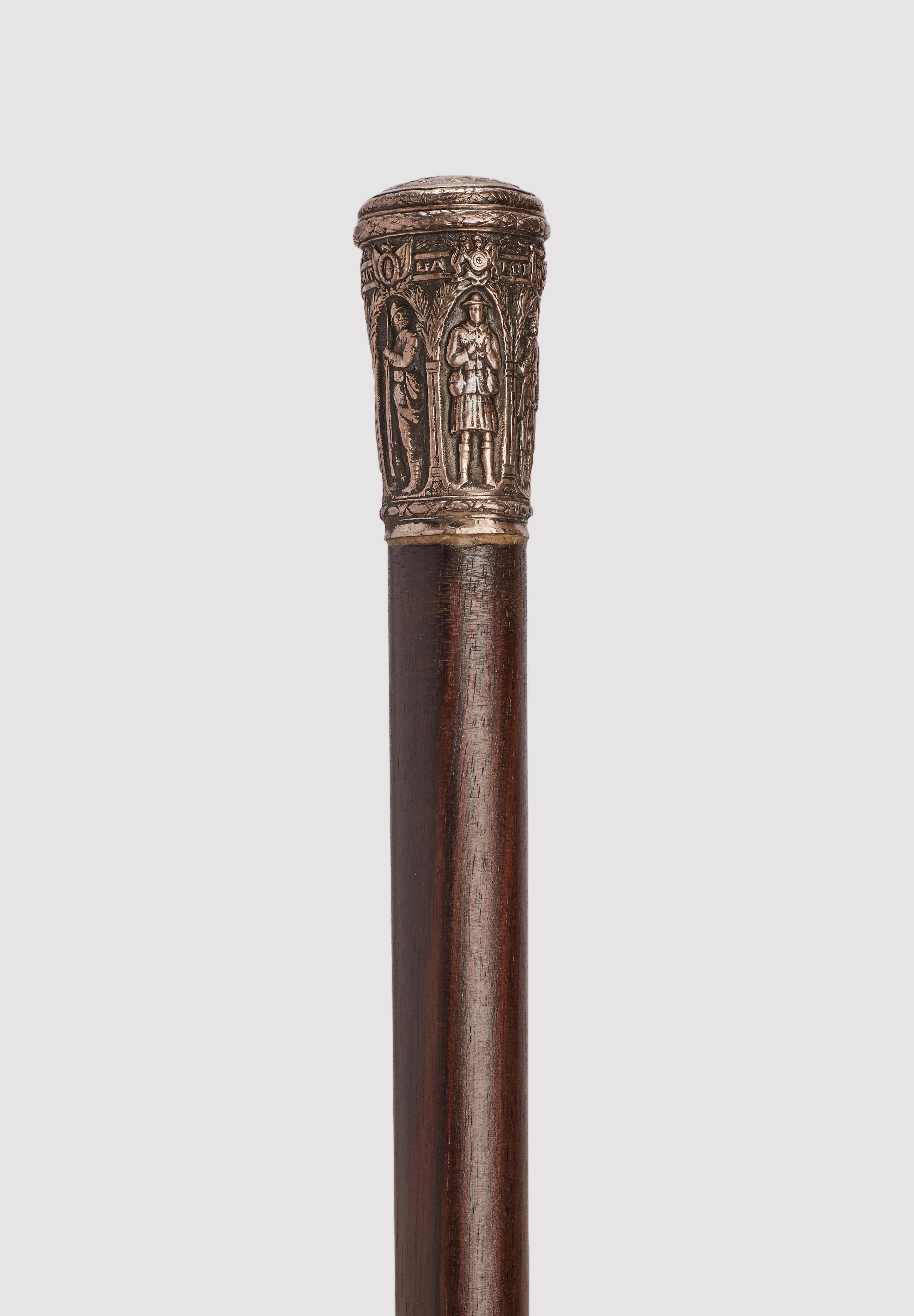 Walking stick: silver knob milord shape handle, depicting six soldiers, representing six European states involved in the First World War conflict. Ebony macassar wood shaft. Metal ferrule. France, 1915.