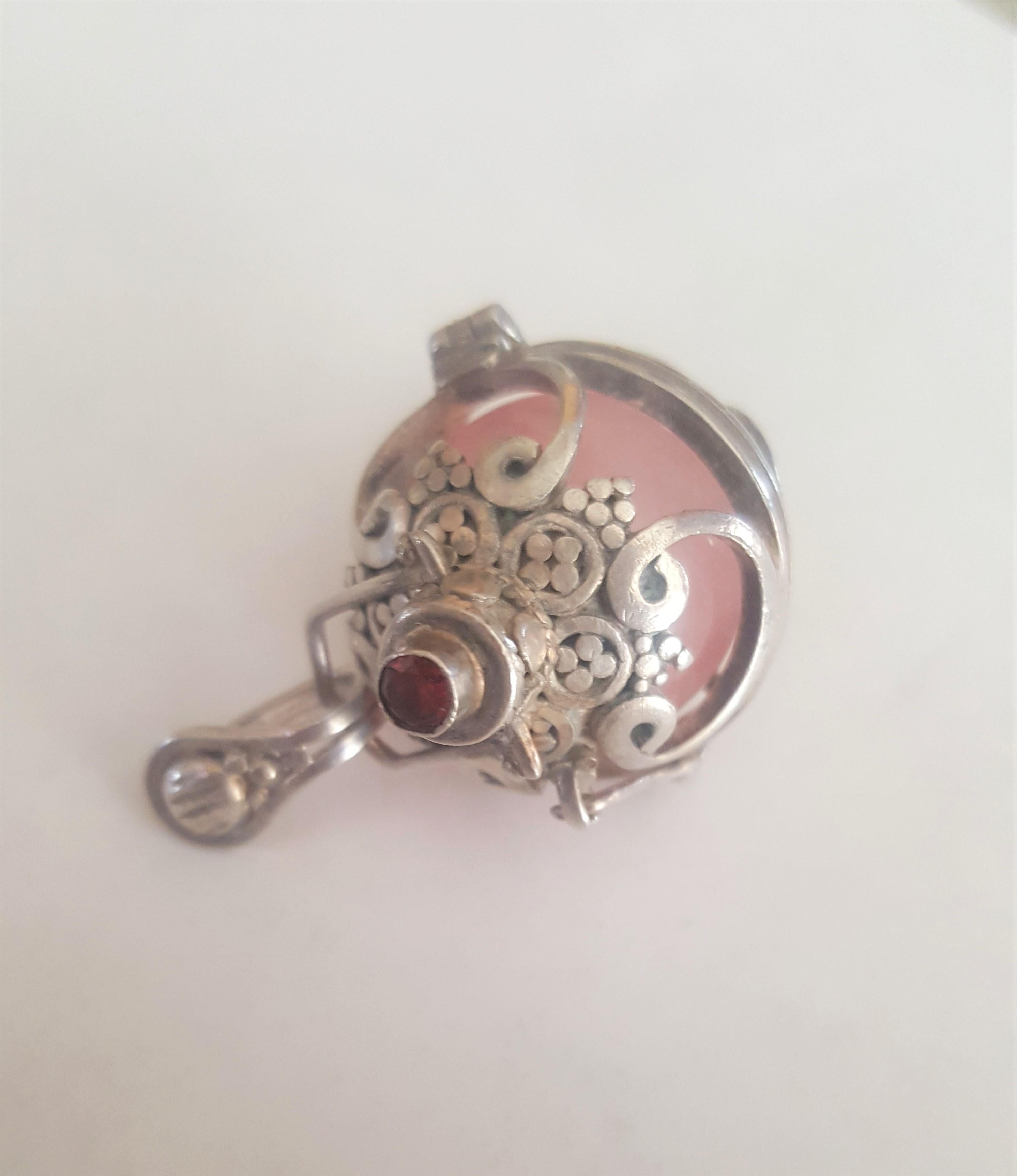Silver Harmony Ball Pendant with Rose Quartz Ball and Garnet Accent In Good Condition In Rancho Santa Fe, CA