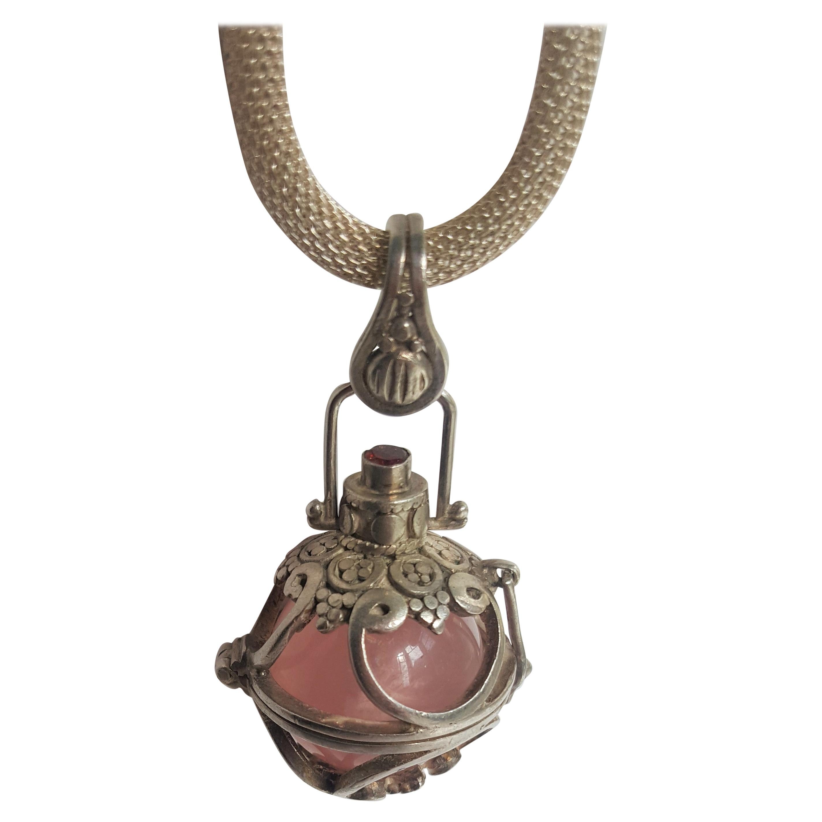 Silver Harmony Ball Pendant with Rose Quartz Ball and Garnet Accent