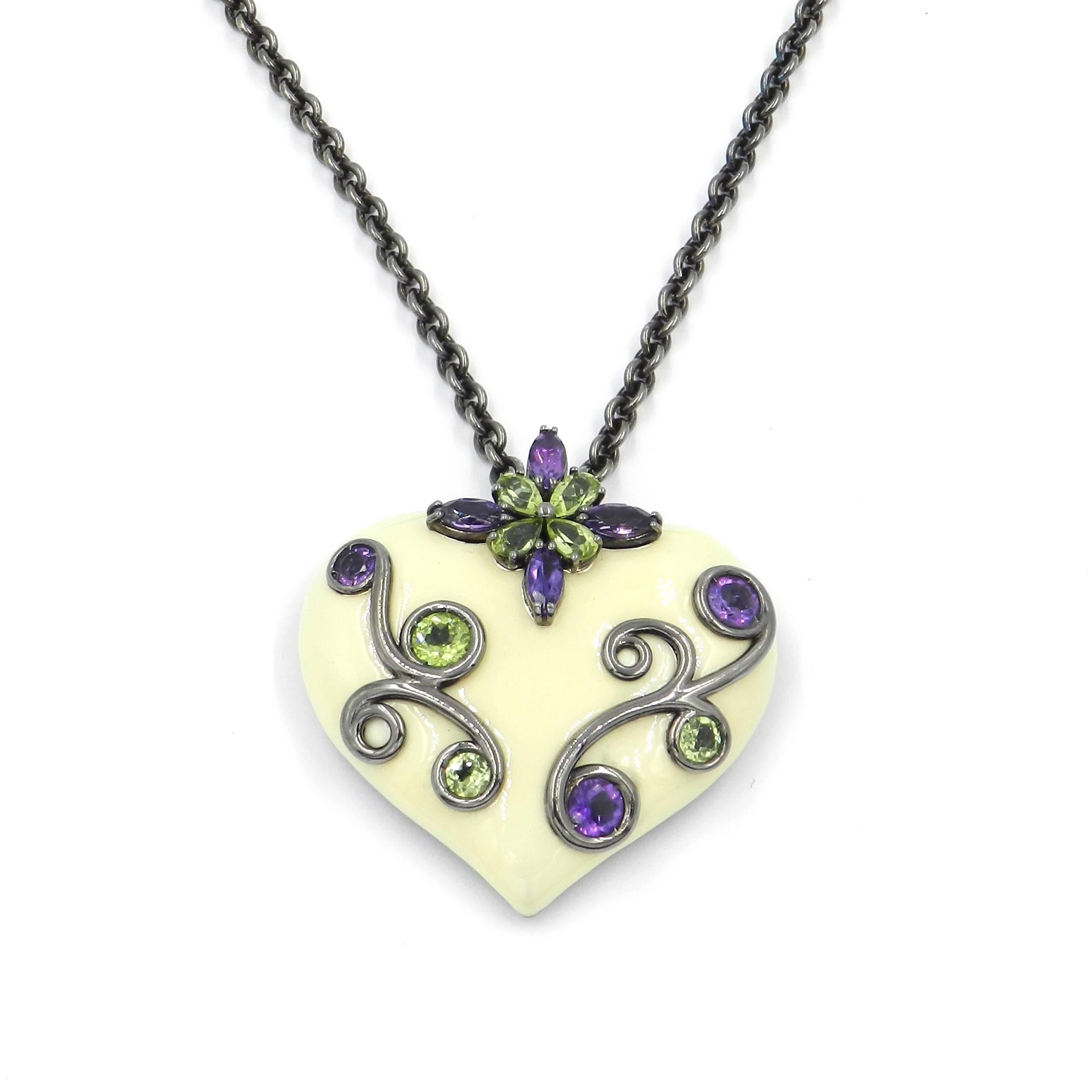 Originally designed across the millenium this fabulous chain with pendant is in silver and features a total of carat 1.60 of peridot and amethyst. The pendant size is mm 40 X 35. The chain lenght is 50 cm. Handcrafted in Italy, from the Garavelli