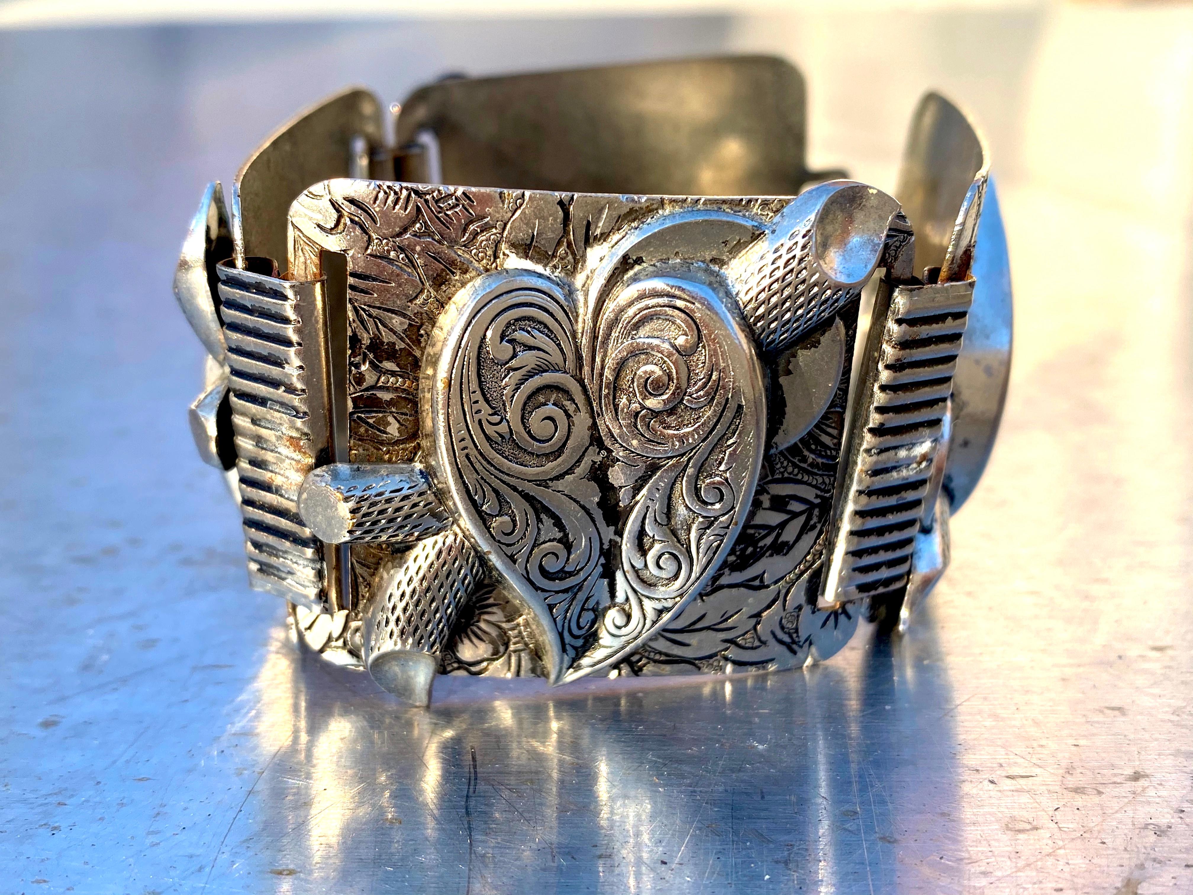 Fabulous and stunning design of hearts in reverse order, straight up and upside down creating one of the most incredible vintage aluminum bracelets I have ever seen.  Simply chic, visually graphic and a real statement piece. Retro art at its best. 