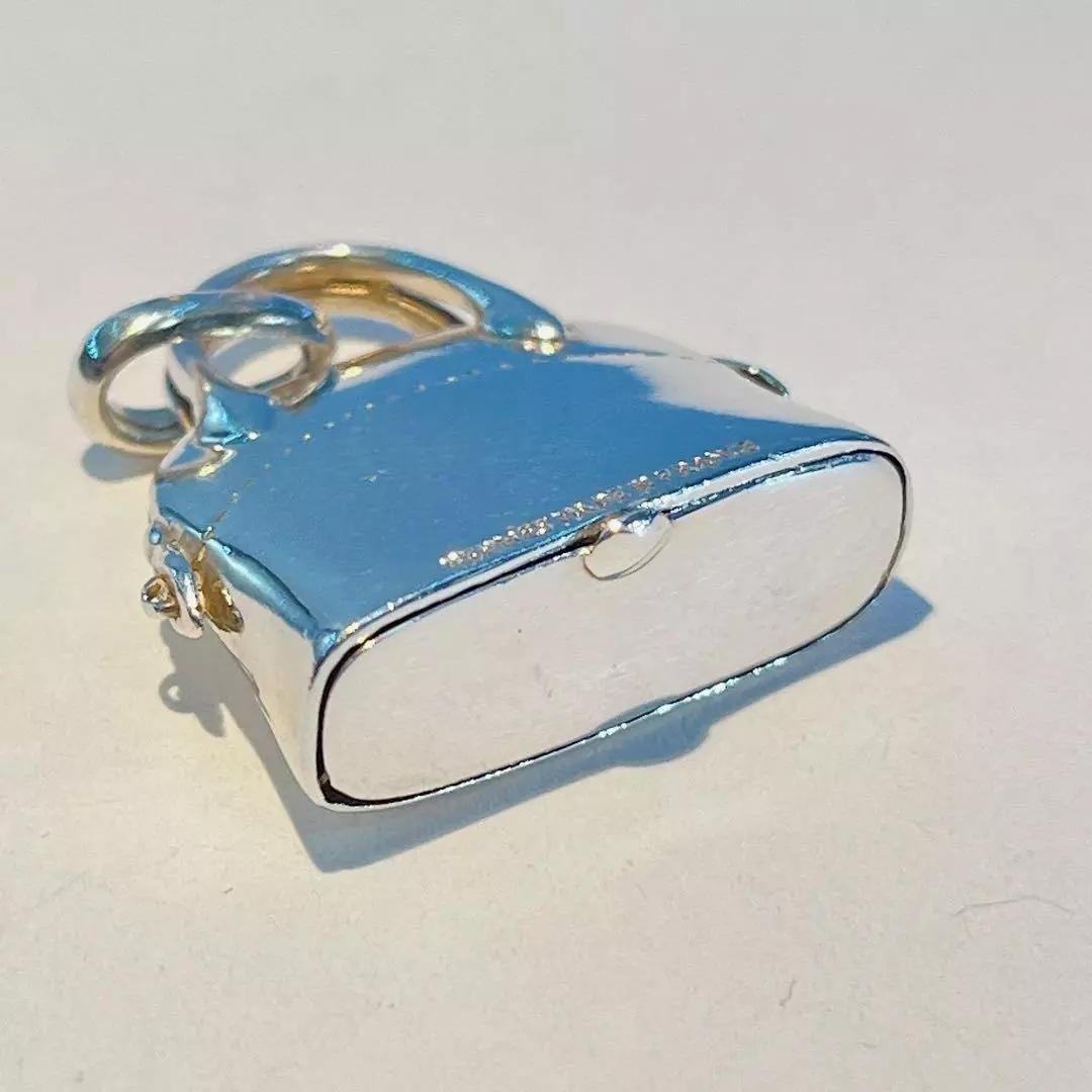 Mini Hermès pill box in the shape of the iconic Bolide Bag. This small bag is made from sterling silver, and opens up from the bottom of the bag. 