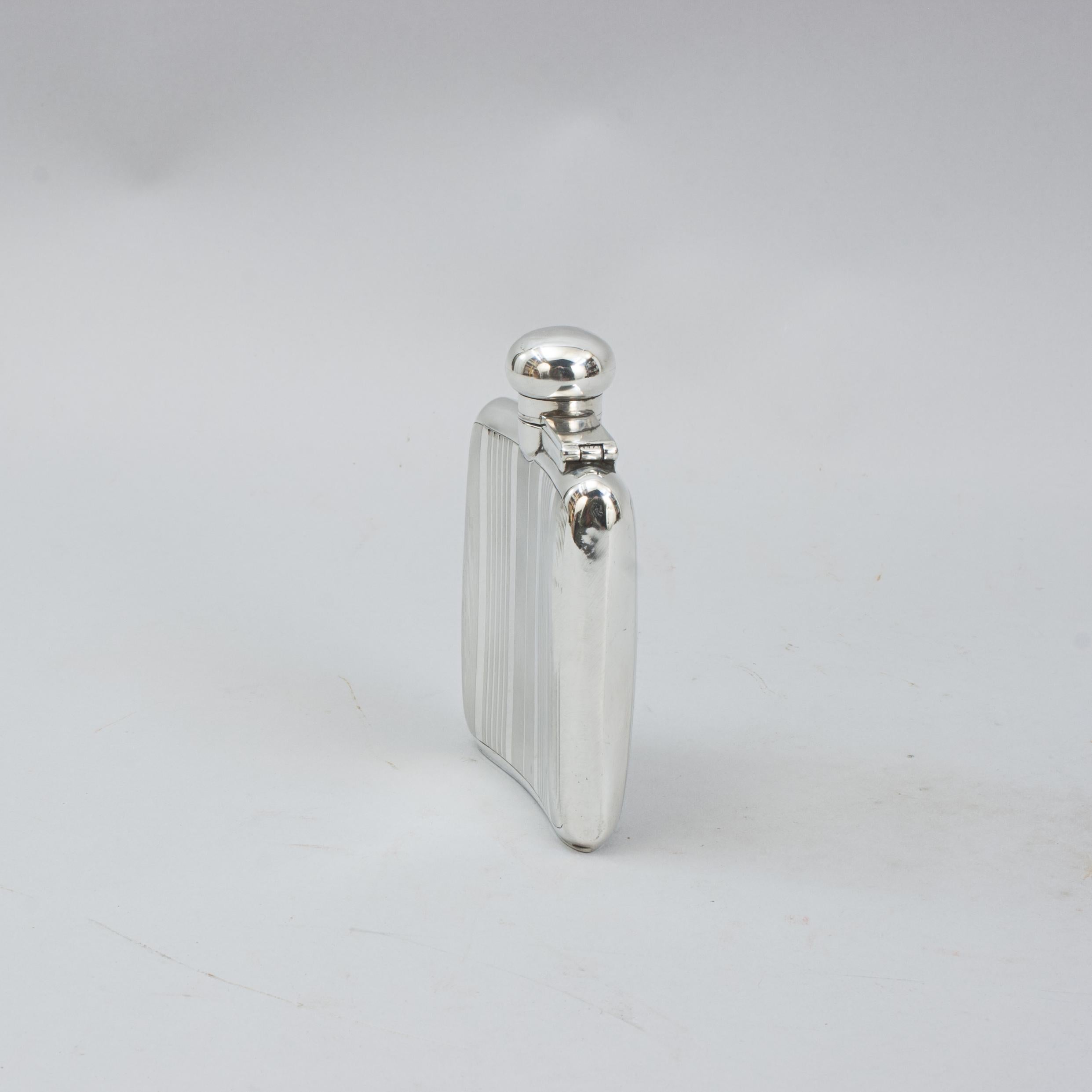 Silver Hip Flask.
A beautiful gentleman's curved body pocket silver spirit hip flask. This hip flask with plain domed hinged lid with screw bayonet fitting, hallmarked London. We believe it dates from the 1930's although the two date Hallmarks are
