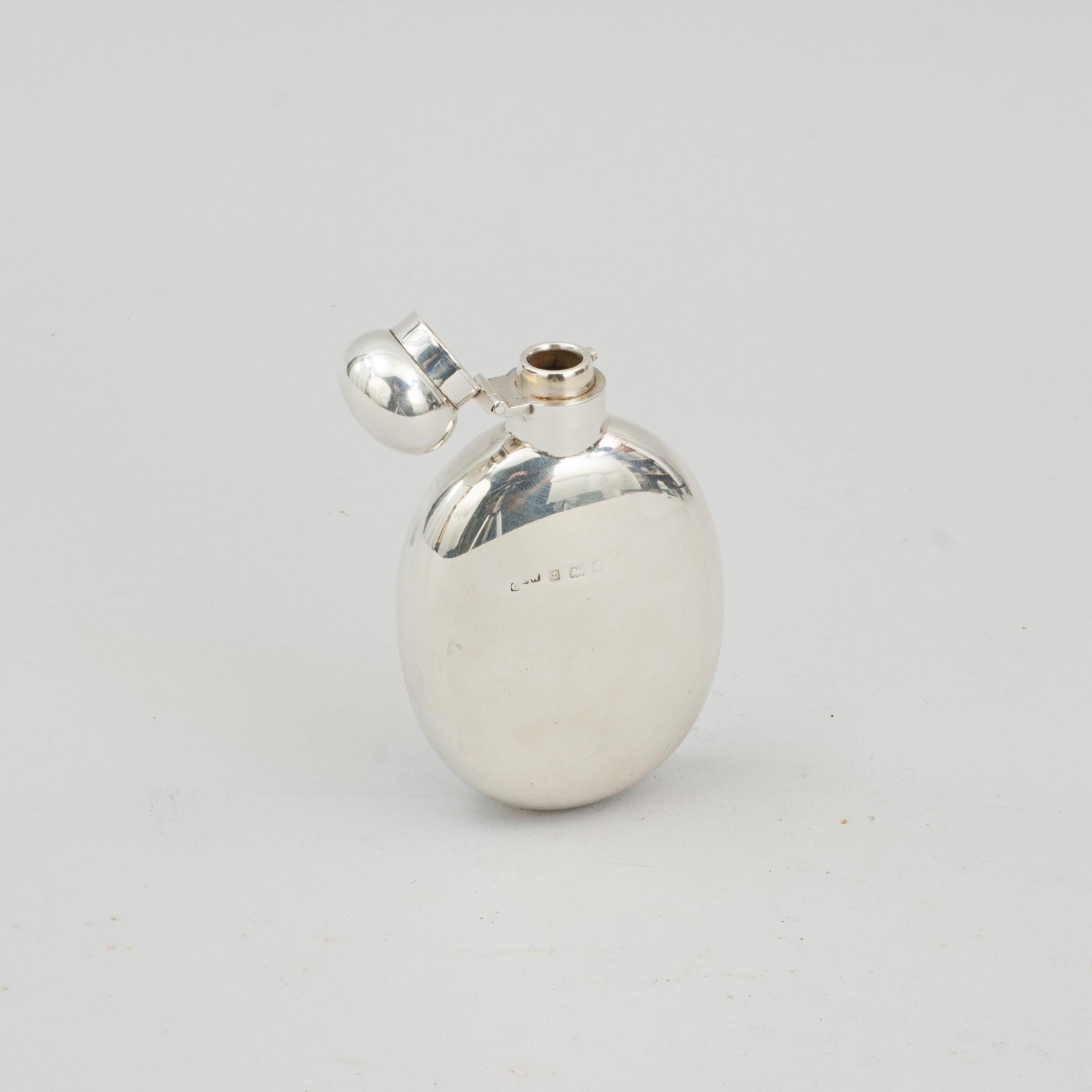 Silver Hip Flask.
A beautiful gentleman's oval pocket silver hip flask with a curved profile. This exceptional hip flask with plain domed hinged lid with screw bayonet fitting. The hallmarks have been rubbed and are difficult to read but there is a