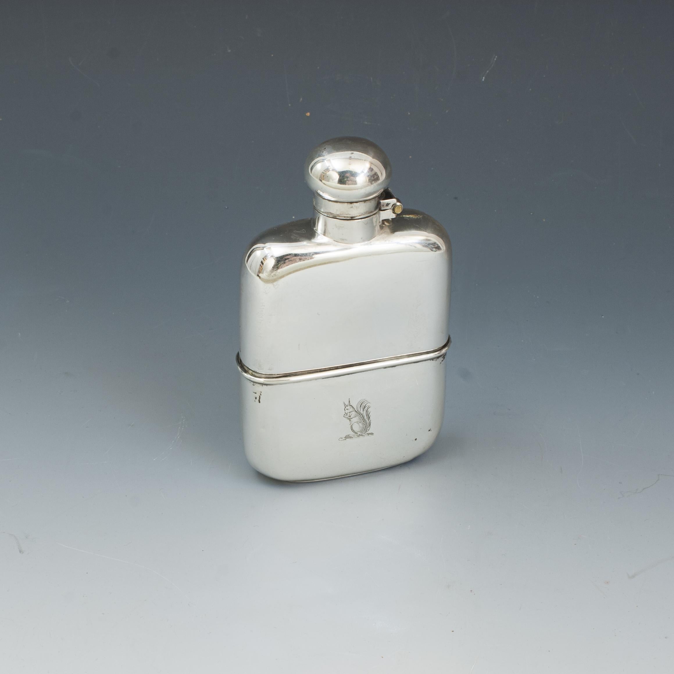 Hawksley Silver Hip Flask.
A beautiful gentleman's pocket silver spirit hip flask by George and John William Hawksley. This exceptional hip flask with plain domed hinged lid with screw bayonet fitting and retaining the original push fit drinking cup