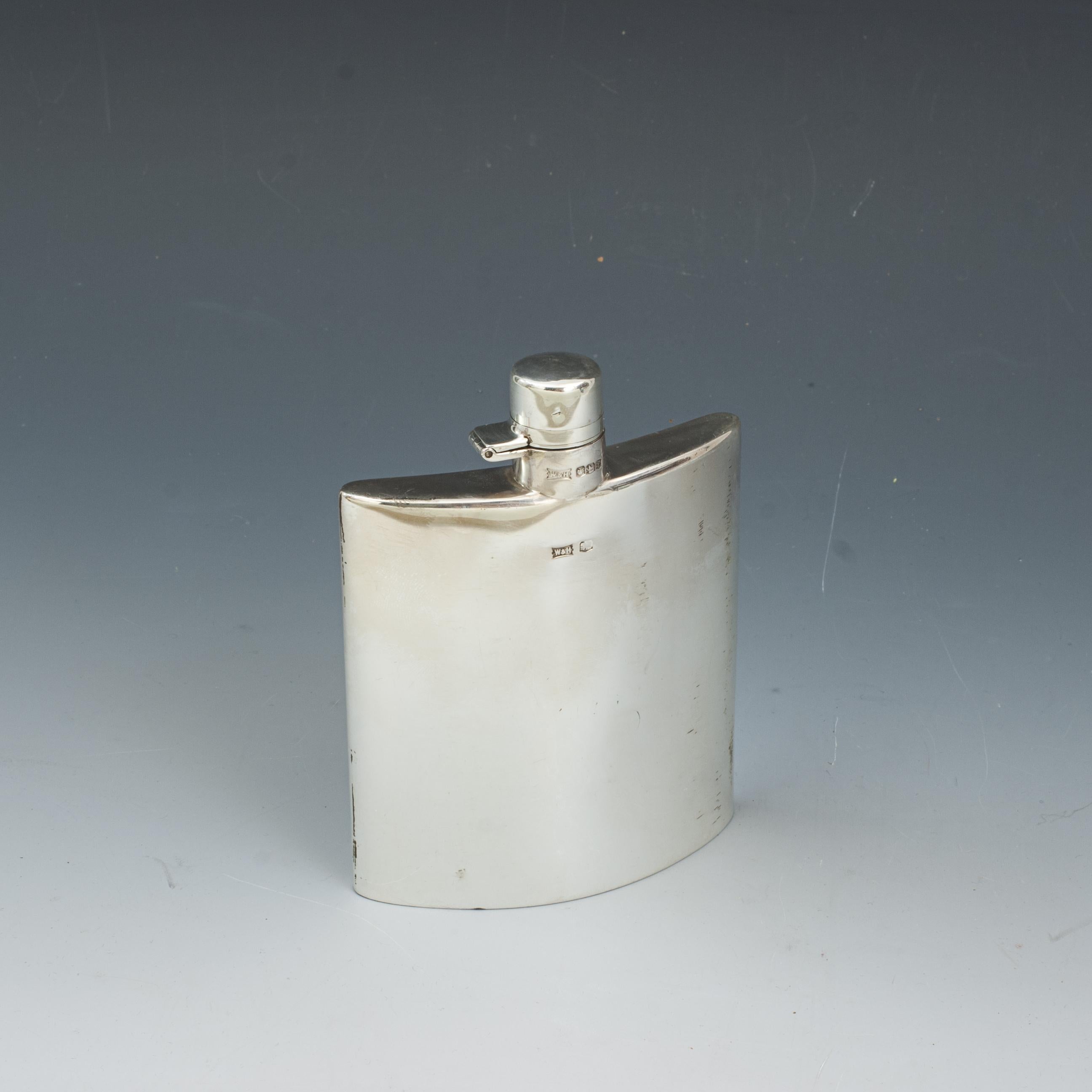 George V Silver Hip Flask.
A good curvilinear hip flask with hinged bayonet top. A beautiful gentleman's silver hip flask with a curved profile, hallmarked Sheffield, 1923, with makers mark 'W & H', Walker & Hall. Stamped on the base 'W & H pennant'