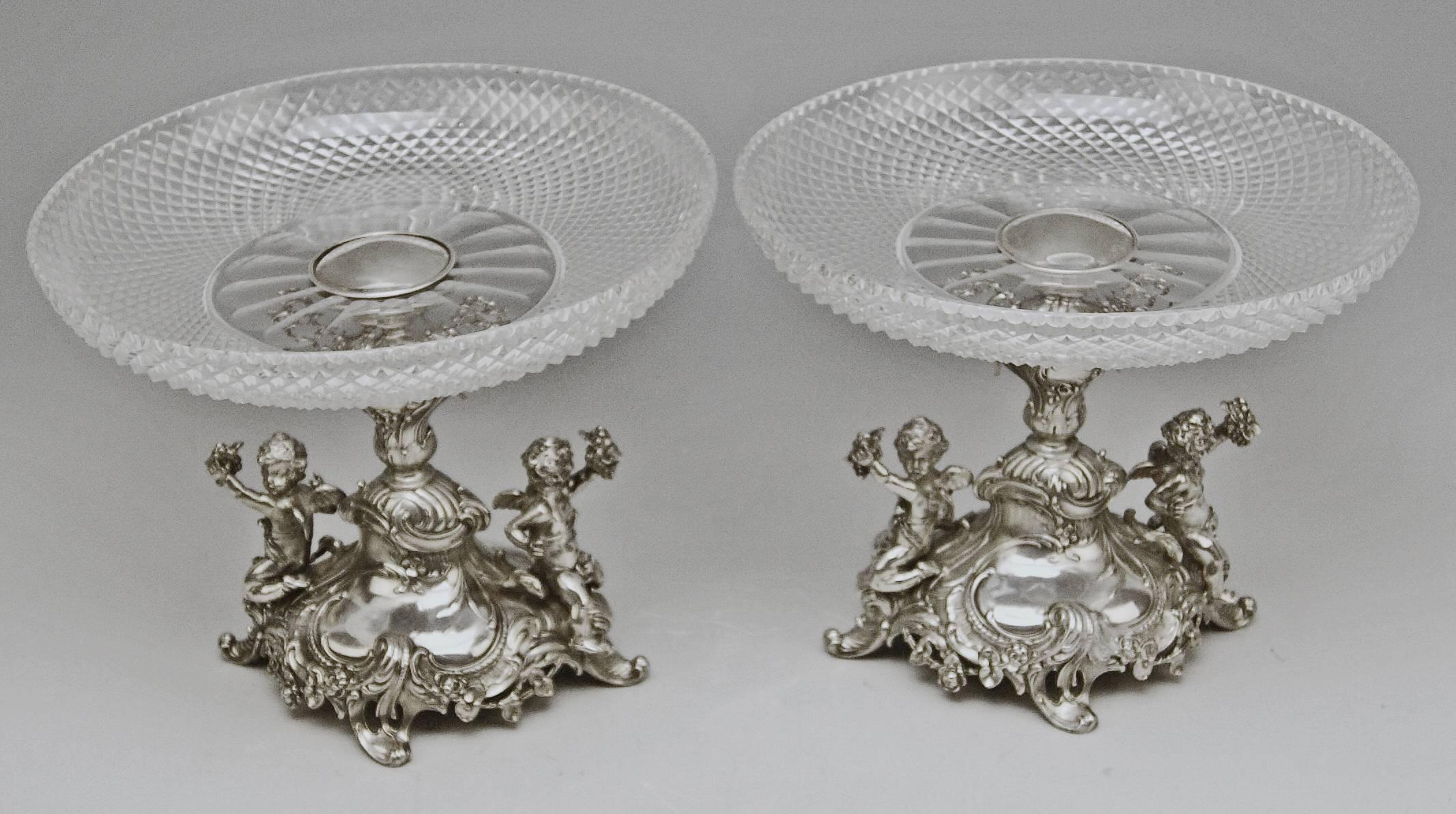 Silver German pair of centrepieces / centerpieces with original glass platters, made by Bruckmann and Sons (GERMANY).

Style of Historicism (made circa 1890)
Silver 800
branded by German Crescent with Crown
Austrian Silver Import Sign existing,