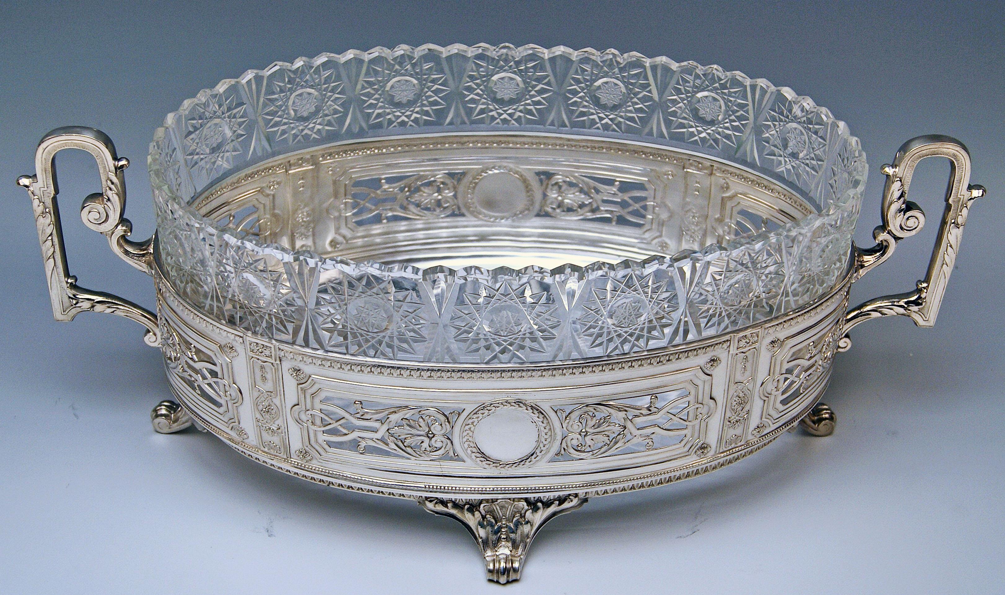 Silver 800 German huge flower bowl / centrepiece with original gorgeous glass liner.

Decorative style / transition to Art Nouveau / made circa 1900

Hallmarked:
-- SILVER 800
-- branded by German Crescent with Crown (used as from the year