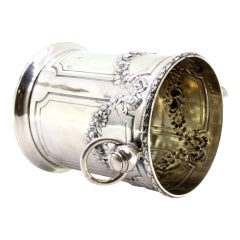 Silver ice bucket w/ floral reliefs, bows, garlands & ring handles