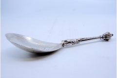 Silver ice cream scoop with embossed handle, engraved shell and dragon head