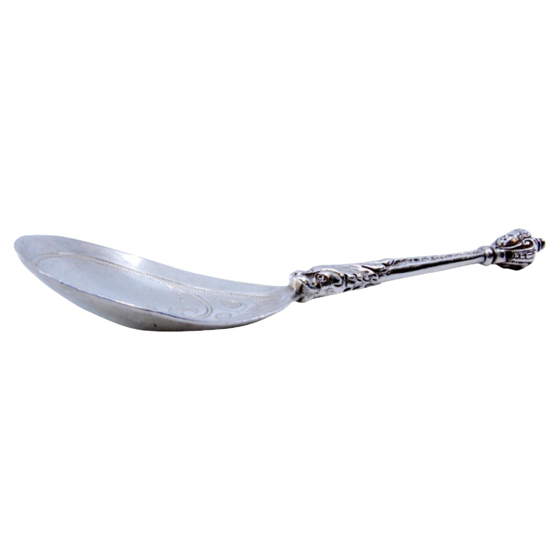 Silver ice cream scoop with embossed handle, engraved shell and dragon head