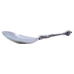 Silver ice cream scoop with embossed handle, engraved shell and dragon head