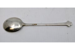 Silver ice cream scoop with fleur-de-lis on the handle