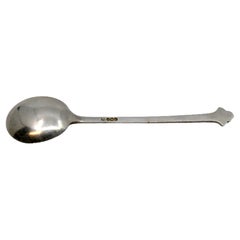Silver ice cream scoop with fleur-de-lis on the handle
