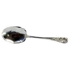 Silver ice cream scoop with reliefs on the handle