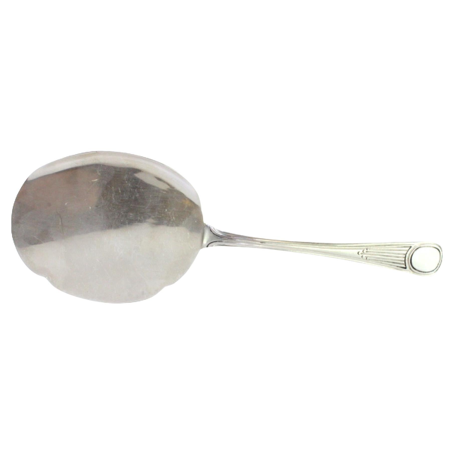 Silver ice cream scoop with smooth shell and crimped handle reliefs