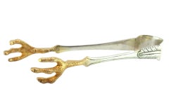 Silver ice tongs in the shape of bird claws