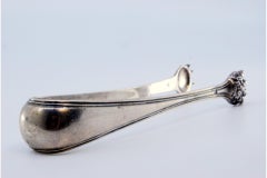 Silver ice tongs in the shape of claws
