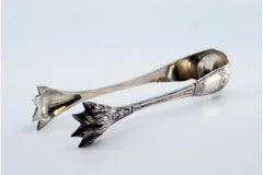 Silver ice tongs in the shape of claws