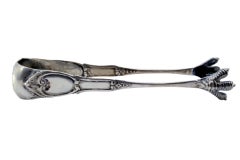Silver ice tongs in the shape of claws