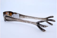 Silver ice tongs in the shape of embossed claws