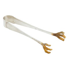 Silver ice tongs with reliefs