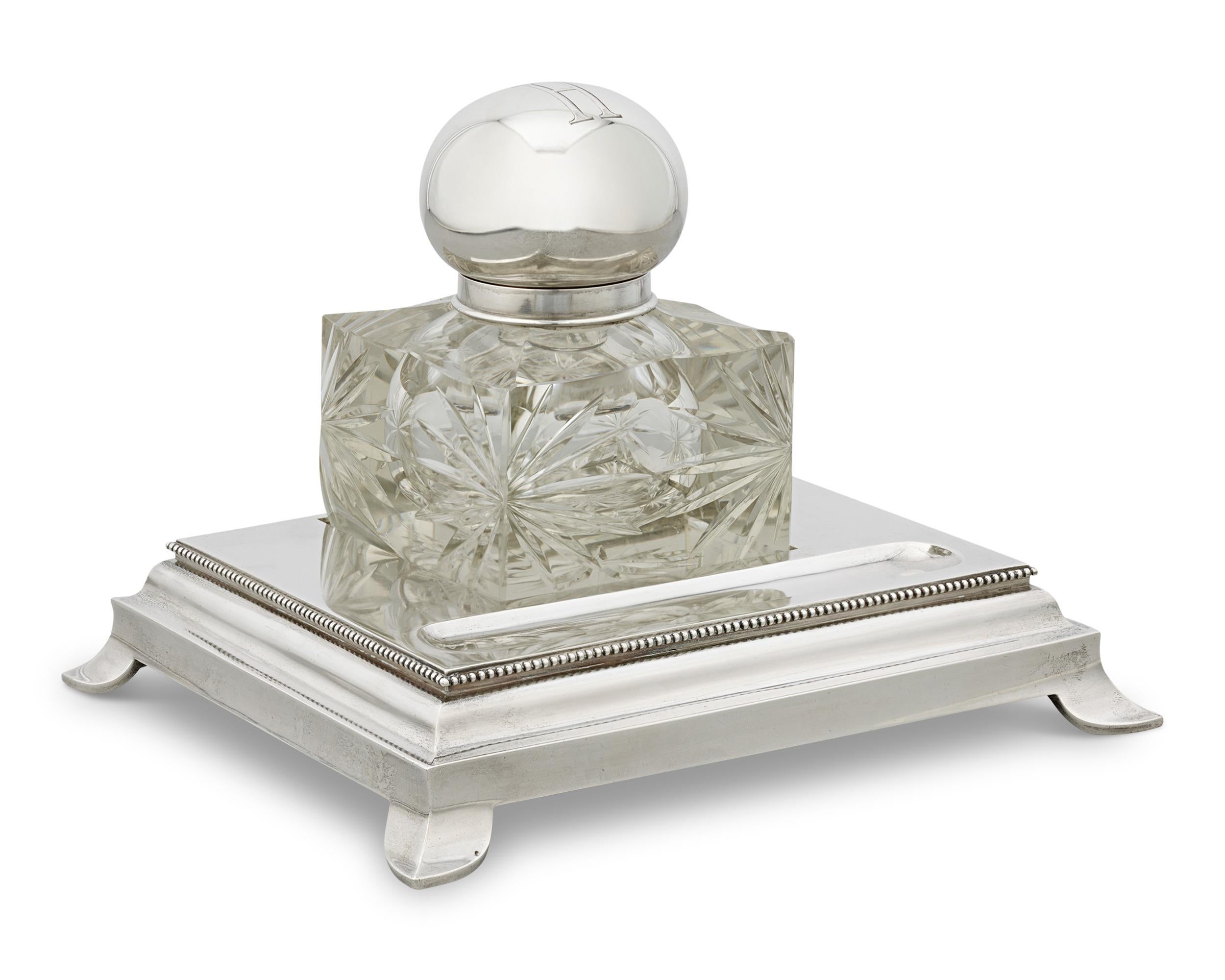 This exquisite inkwell by the legendary Grachev Brothers was made for Czar Nicholas of Russia. Featuring intricately cut glass in a star pattern, the inkwell rests upon an exquisite silver base. Its refined, neoclassical design is completed by a