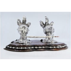Silver inkwell on rosewood with helmet-shaped tanks & pen holder