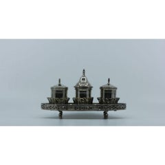 Silver inkwell w/ rack, two reservoirs, pen holder, bell & standing on four feet