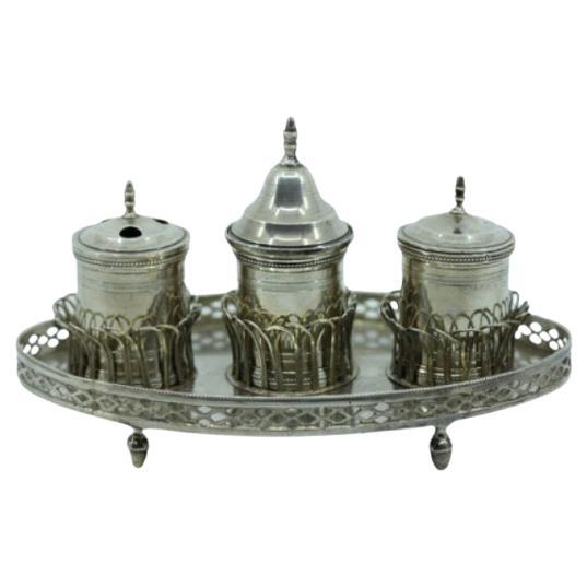 Silver inkwell w/ rack, two reservoirs, pen holder, bell 
standing on four feet
