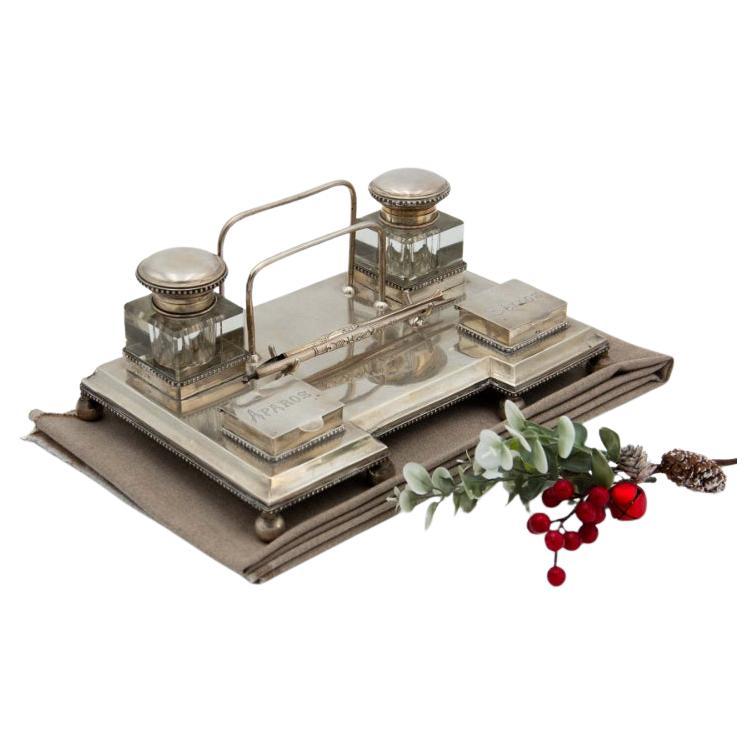 Silver inkwell with acanthus reliefs, cut-glass tanks 
nib holder