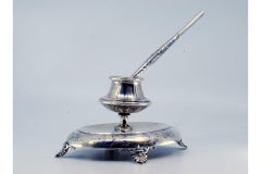 Silver inkwell with chiseled base, four support feet and pen