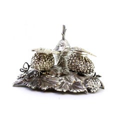 Silver inkwell with grape motifs, bell, sandpit & hinged lids