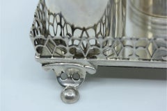 Silver inkwell with grid, two reservoirs & four half-ball feet