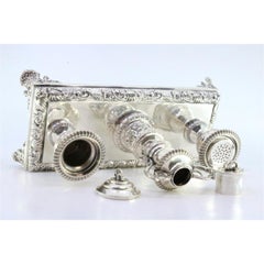 Silver inkwell with reliefs, two reservoirs & four cut-out feet