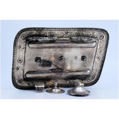 Silver inkwell with three containers & chiseled tray on zoomorphic feet