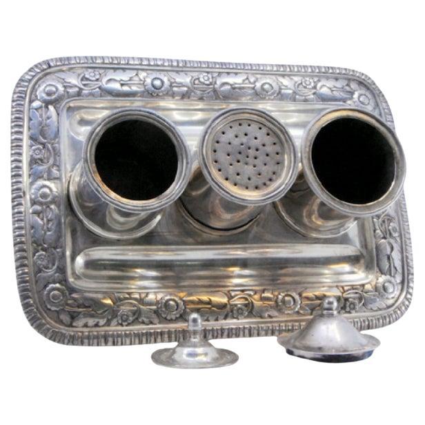 Silver inkwell with three containers 
chiseled tray on zoomorphic feet